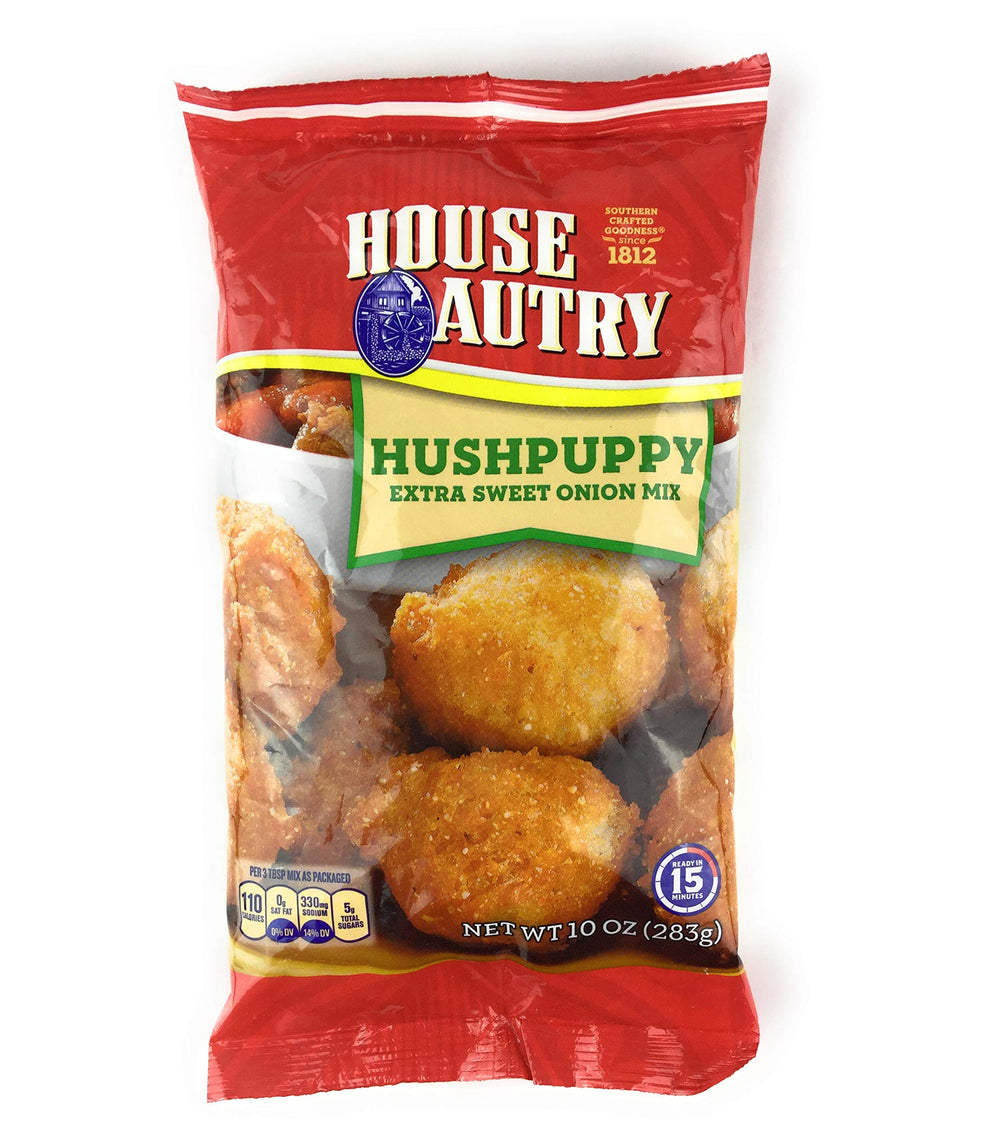House Autry hushpuppies on a plate, golden-brown and crispy.