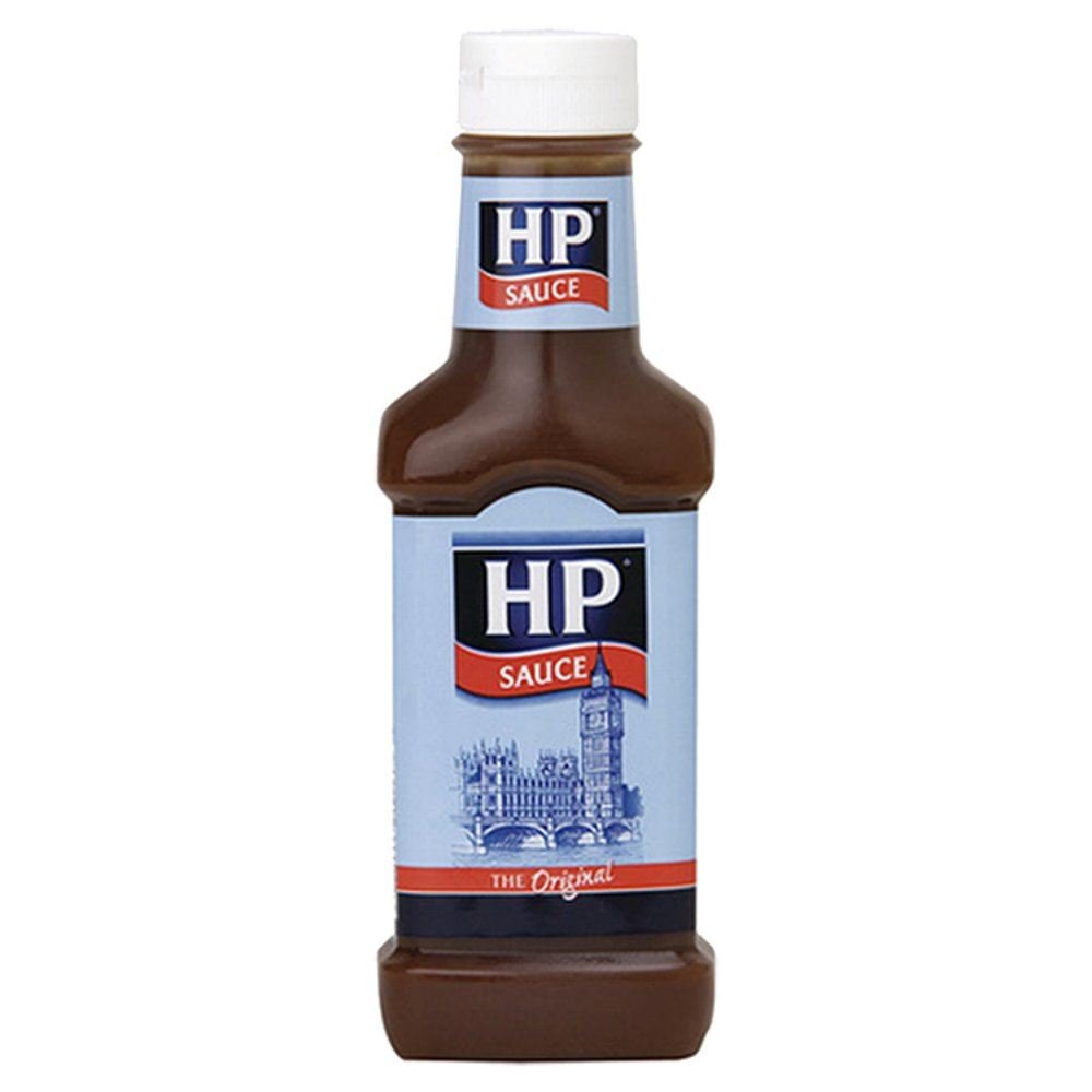 HP Sauce brown bottle pouring on breakfast for savory flavor enhancement.