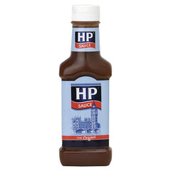 HP Sauce brown bottle pouring on breakfast for savory flavor enhancement.