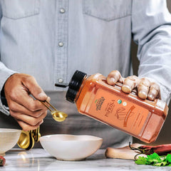 HQOExpress Organic Paprika being poured for a flavorful simmer.