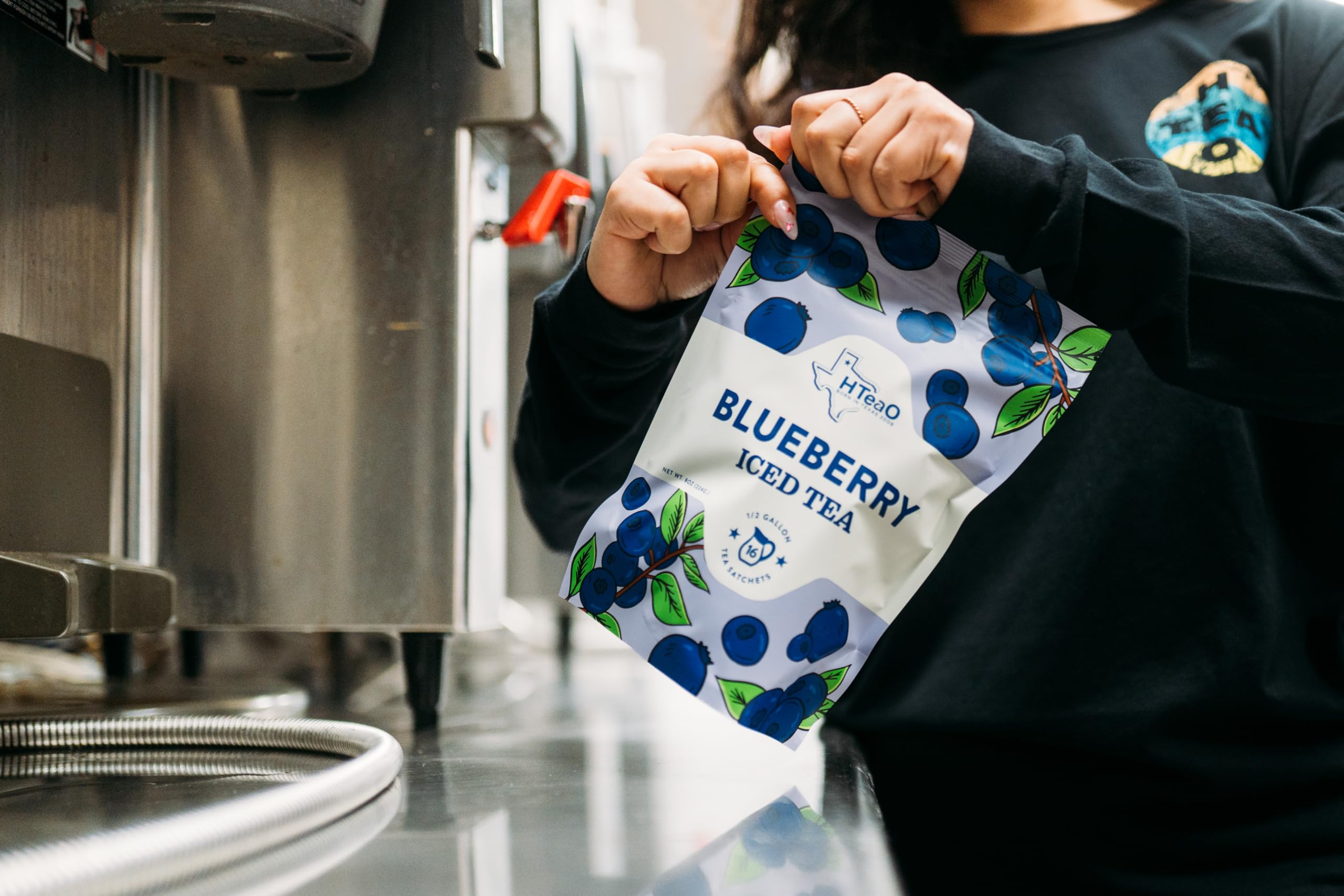 Close-up of sachets and brand on HTEAO Blueberry Green Tea Packets