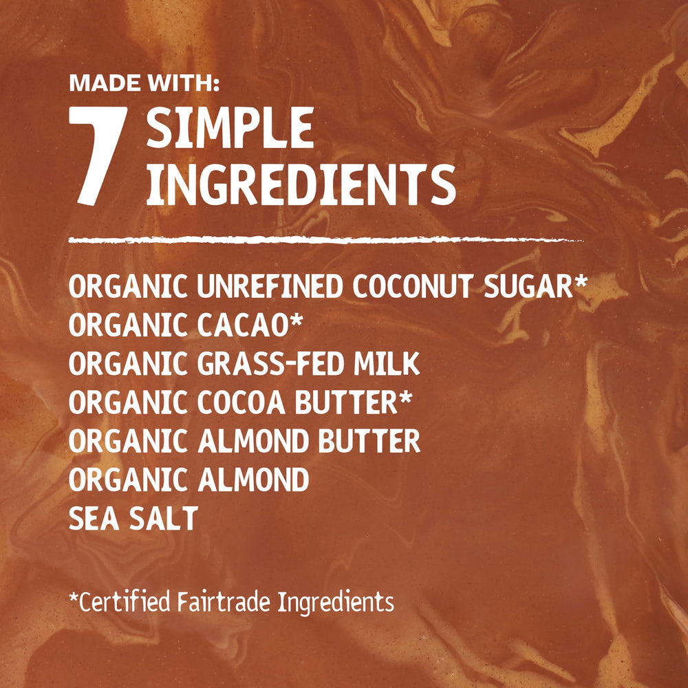 Hu Bar almond butter almond crunch mc on wooden board suggests versatile snacking and baking uses.