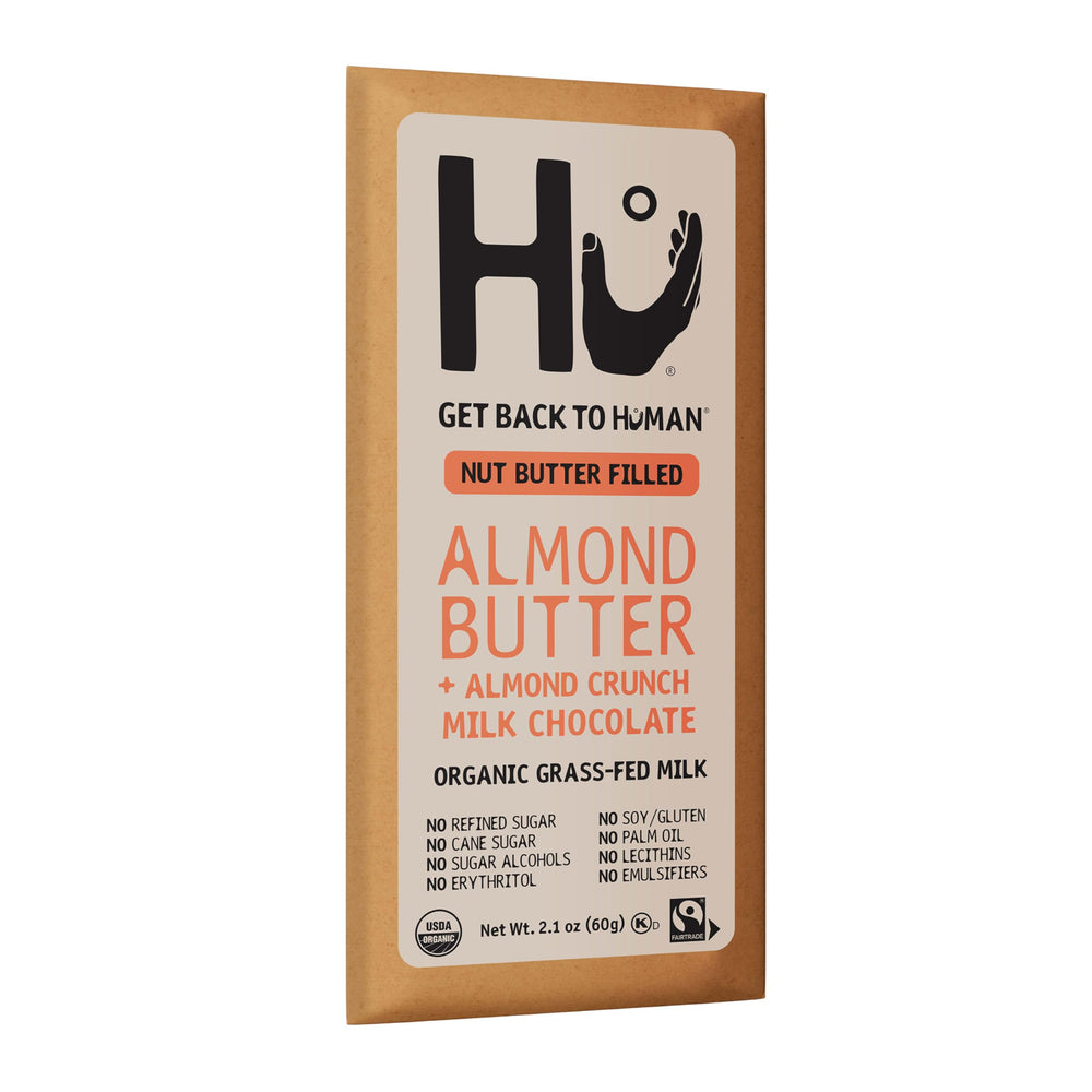 Hu Bar almond butter almond crunch mc displayed with fruit to suggest balanced snacking.