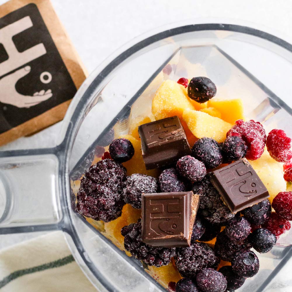 Hu Chocolate Bars cross-section with almond butter and quinoa showcasing texture.