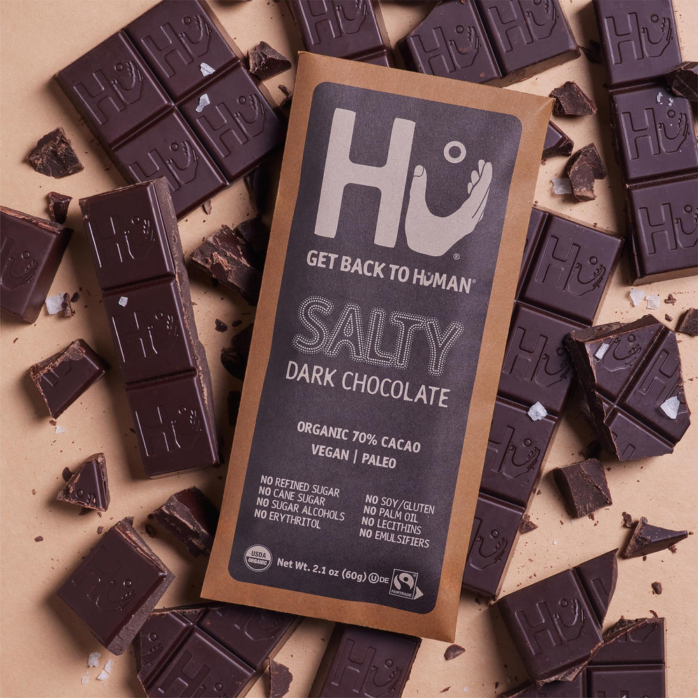 Recycling symbol on Hu packaging promotes sustainability.