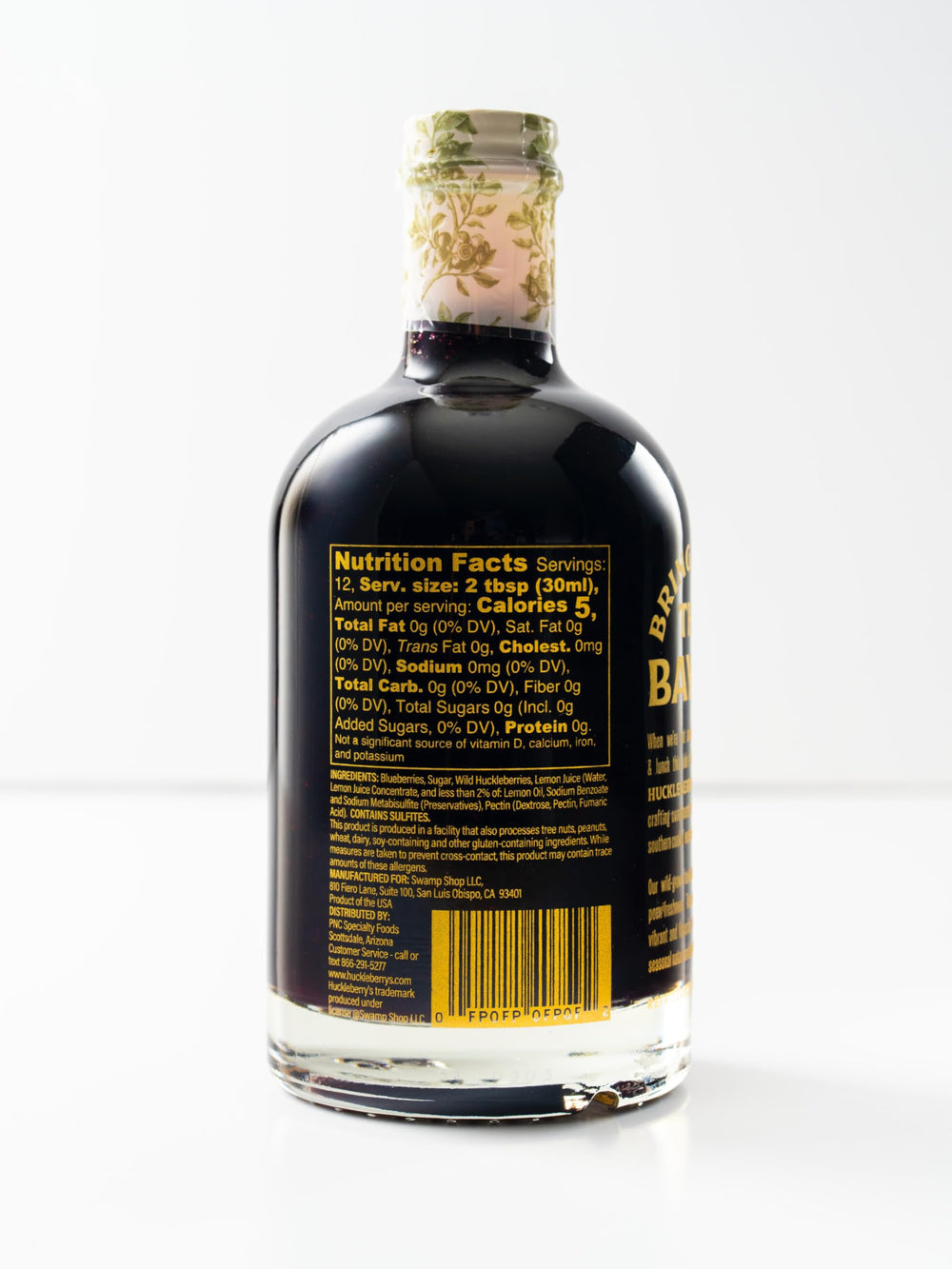 HUCKLEBERRY'S BREAKFAST · LUNCH huckleberry syrup drizzle on waffles highlighting Northwest flavor