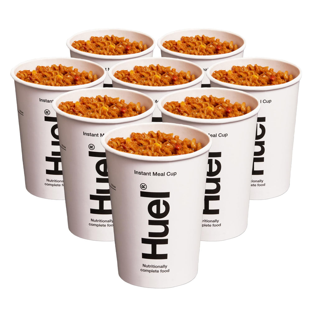 Pouring hot water into Huel Cajun Pasta Cup for instant nourishment