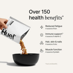 Steam rising from a microwave-ready bowl of Huel Mexican Chili.