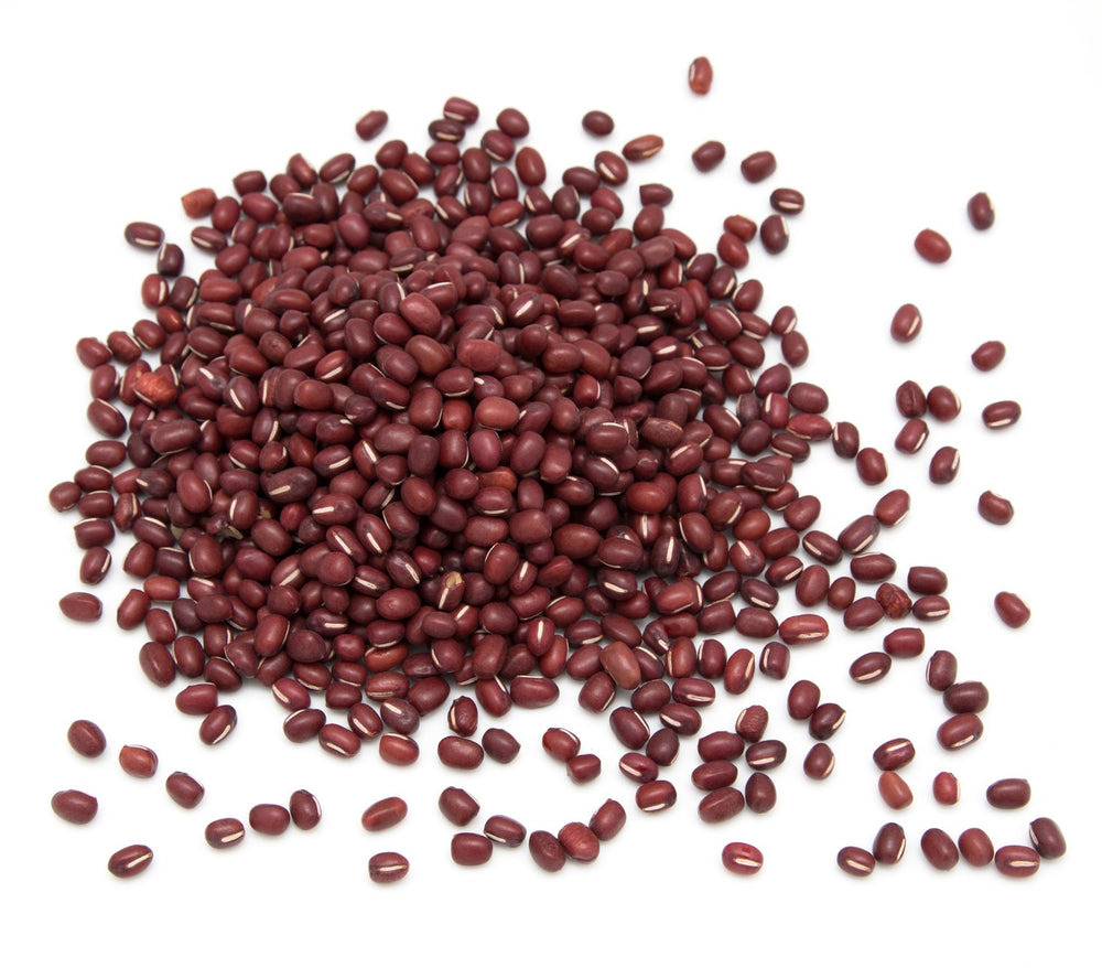 Measuring cup with Hunza Organic Adzuki Beans for portion control