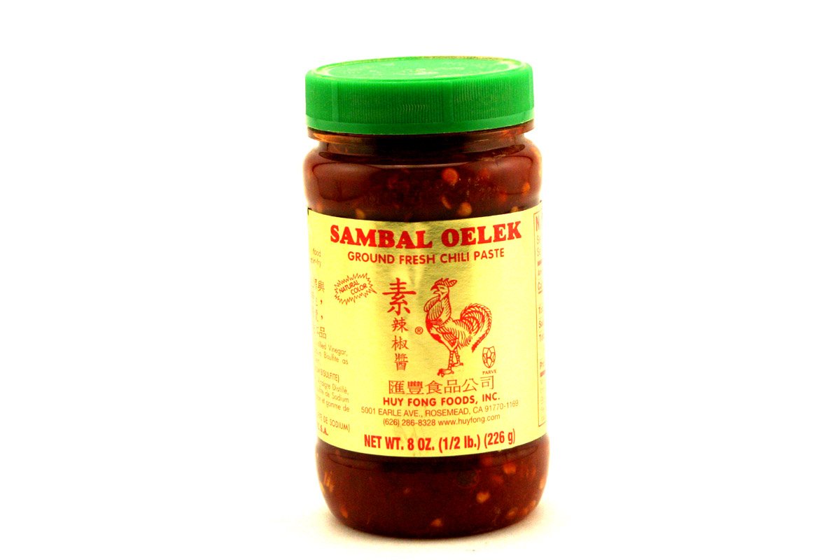 Huy Fong Sambal Oelek ground chili paste bottle adds bright heat without masking delicate flavors.