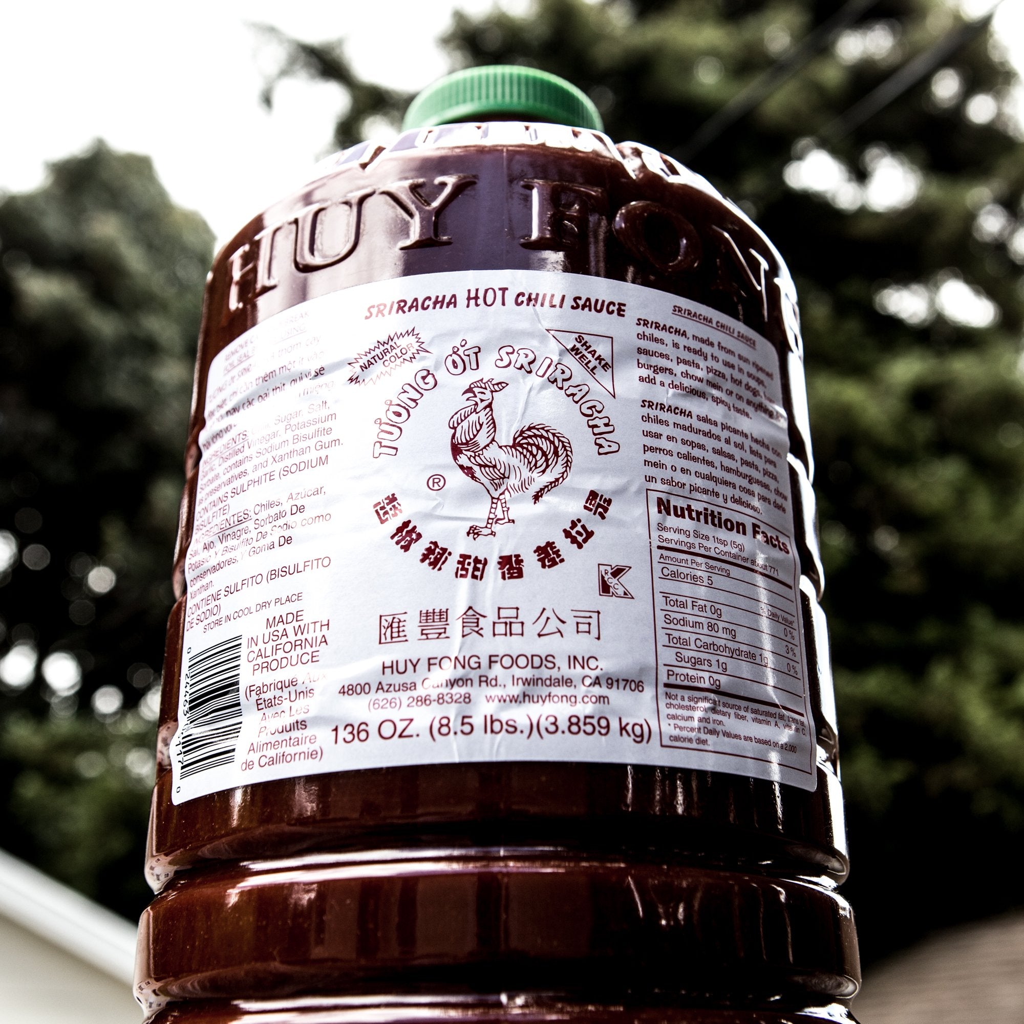 Huy Fong Sriracha sauce bottle on kitchen counter inviting everyday meals