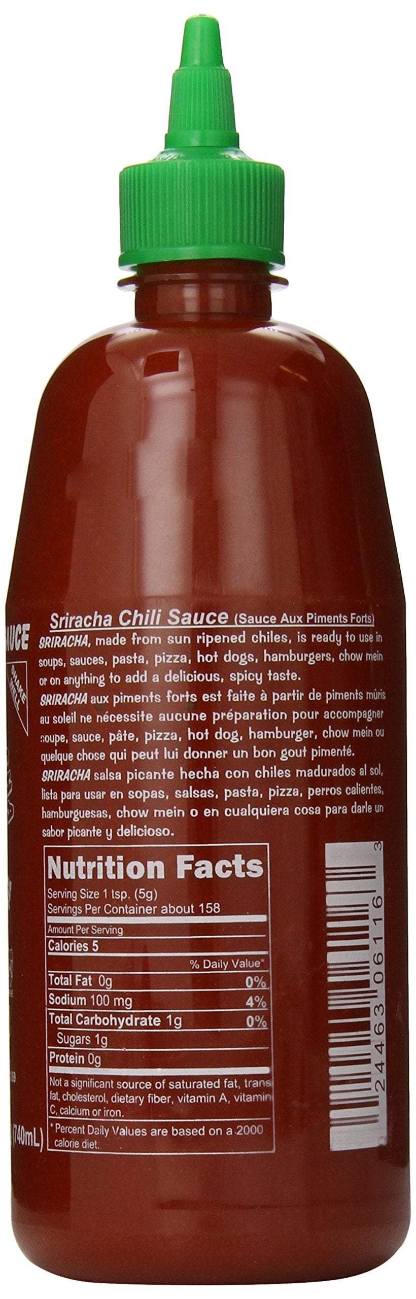 Huy Fong Sriracha sauce dispense close-up shows smooth texture.