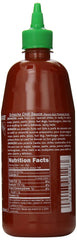 Huy Fong Sriracha sauce dispense close-up shows smooth texture.