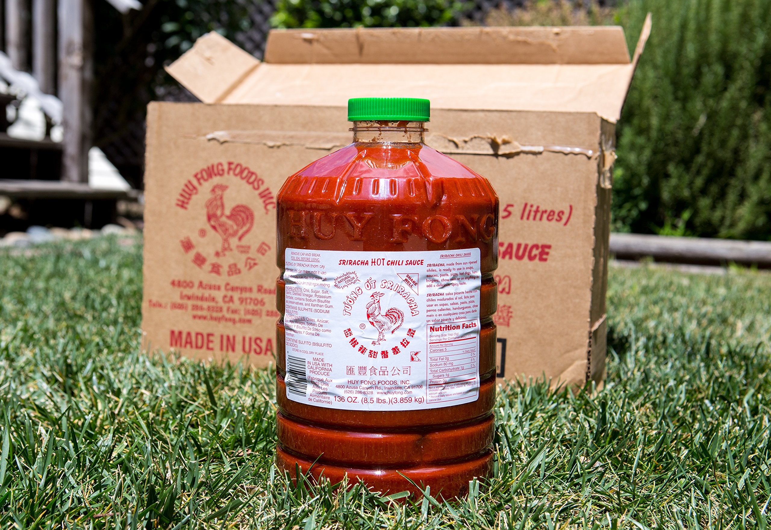 Huy Fong Sriracha sauce on noodles plate for quick fiery flavor boost