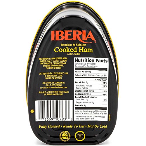 Iberia cooked ham slices on cutting board, ideal for sandwiches and charcuterie.