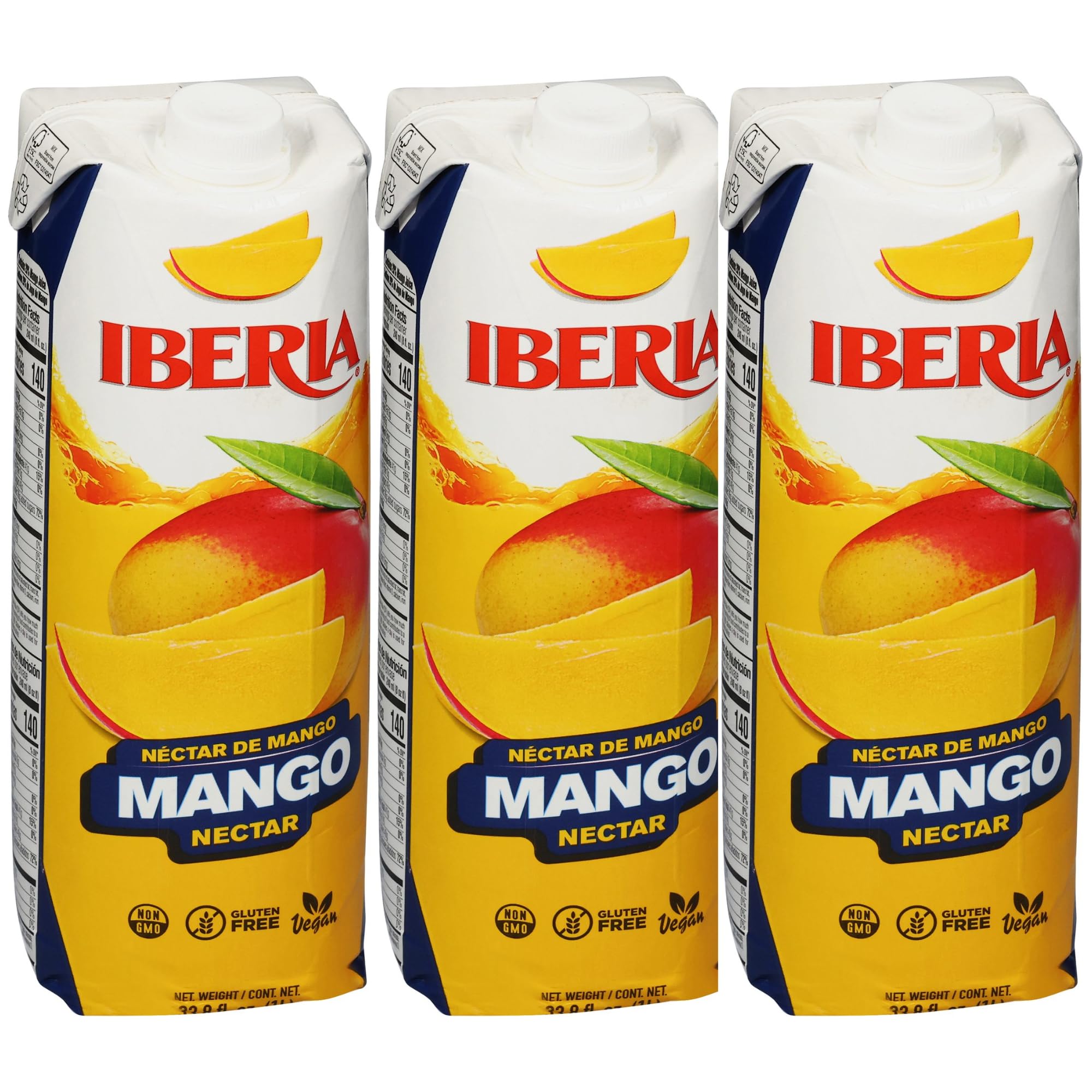 Iberia Mango Nectar bottle on kitchen counter highlights real mango puree for refreshing drinks.