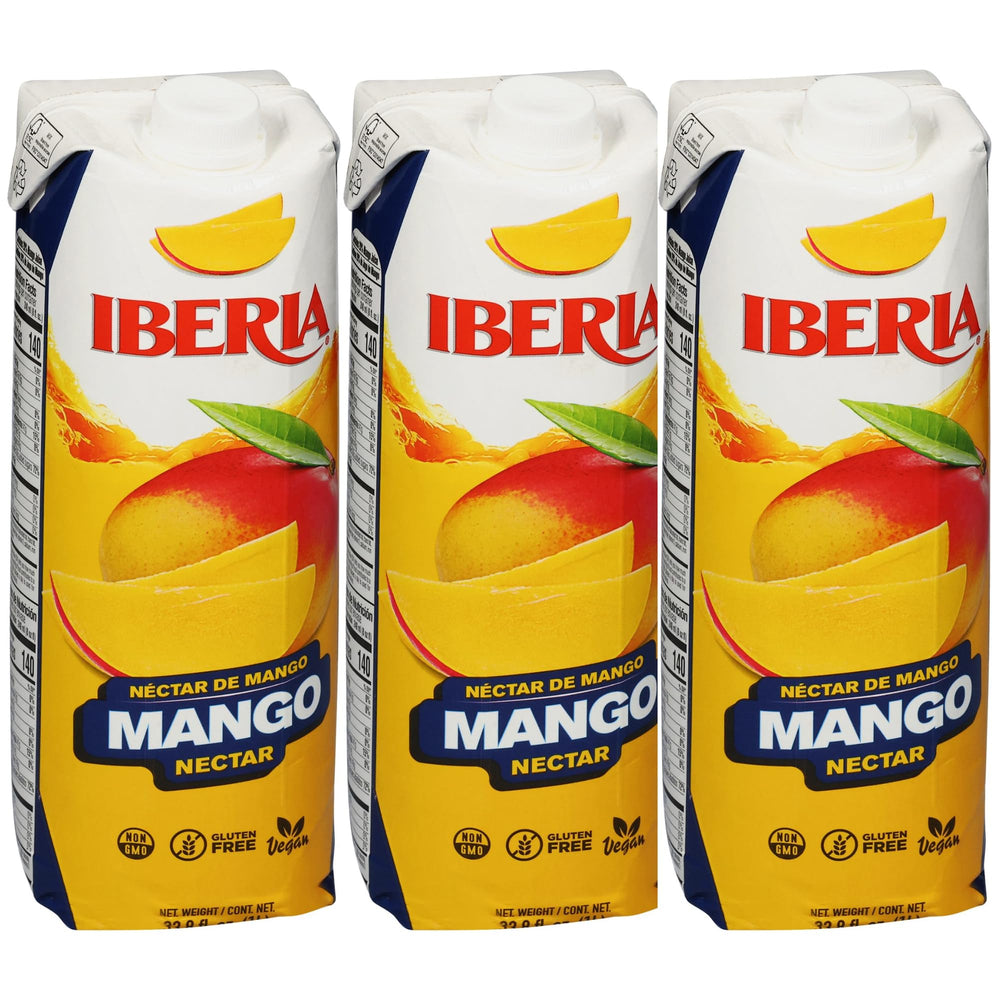 Iberia Mango Nectar bottle on kitchen counter highlights real mango puree for refreshing drinks.