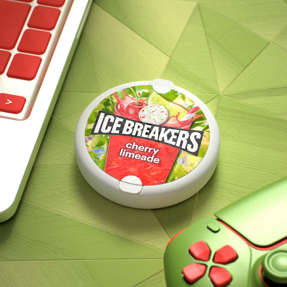Ice Breakers Cherry Limeade mints tin in use, ready to refresh.