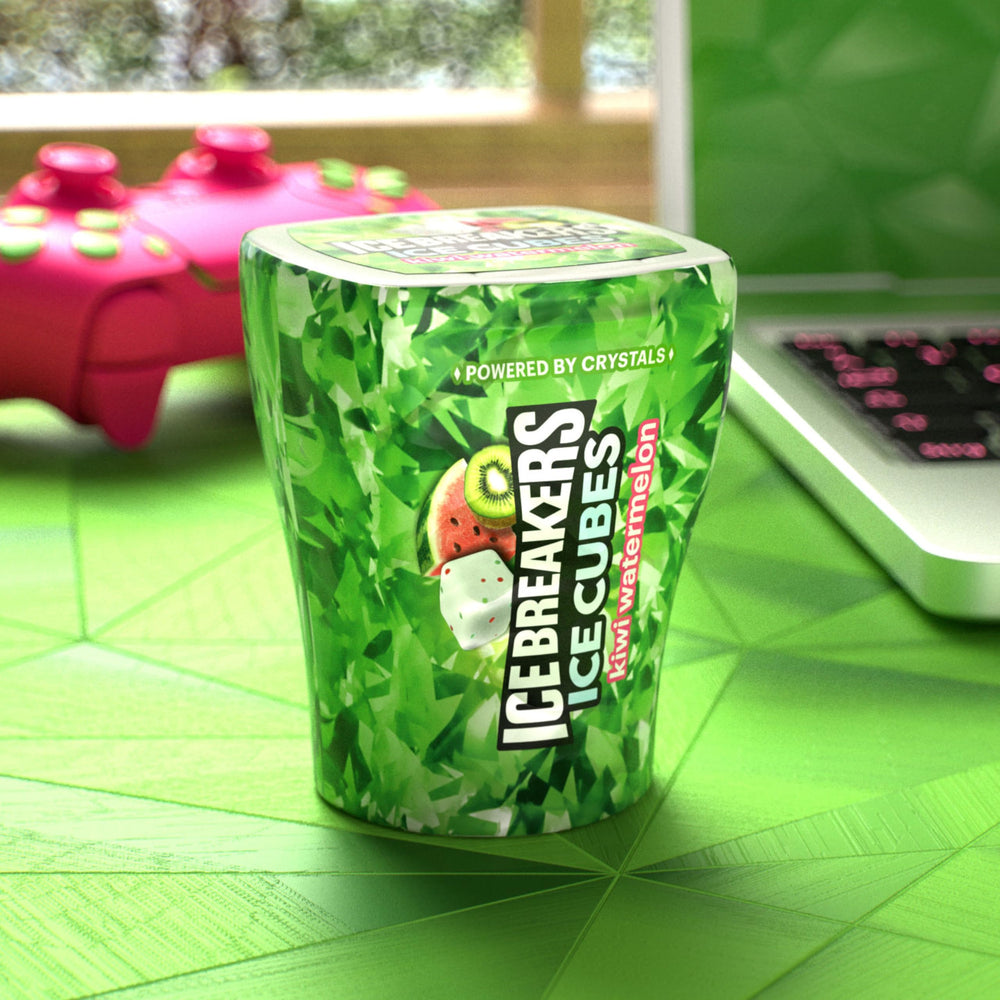 Desk-friendly Ice Breakers Ice Cubes sit beside coffee for quick refresh.