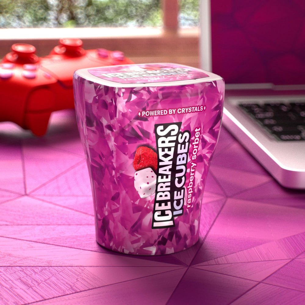 Close-up of Raspberry Sorbet gum pieces inside a cube bottle