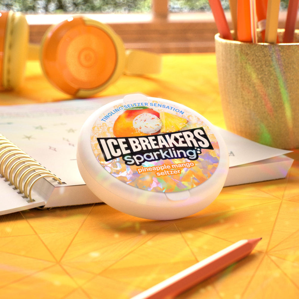 Ice Breakers Sparkling Pineapple Mango desk-drawer tin suggests instant mint pick-me-up.