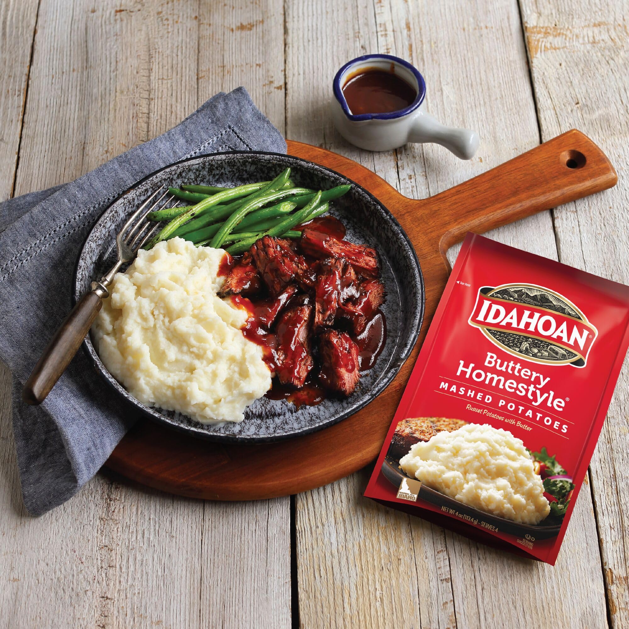 Idahoan Buttery Homestyle Mashed Potatoes ready-to-serve meal idea on a plate.