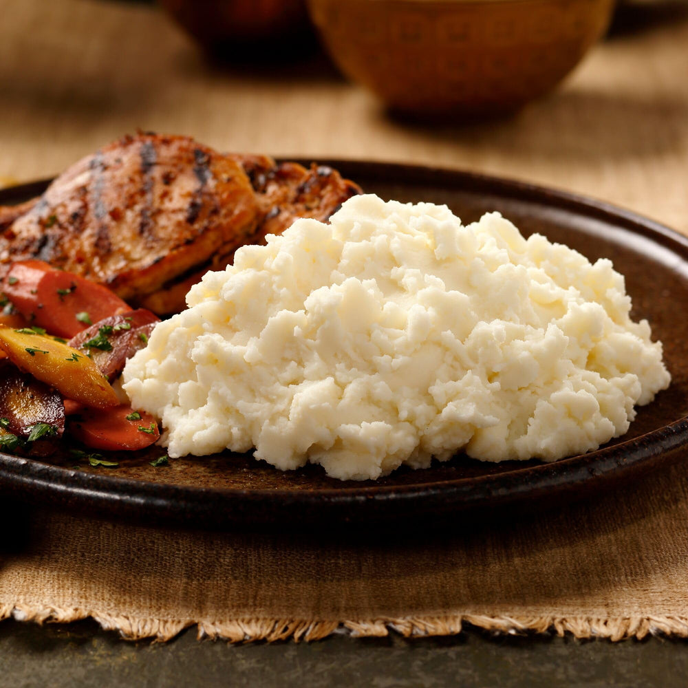 Idahoan Reduced Sodium Mashed Potatoes Buttery Homestyle serving bowl for family meals.