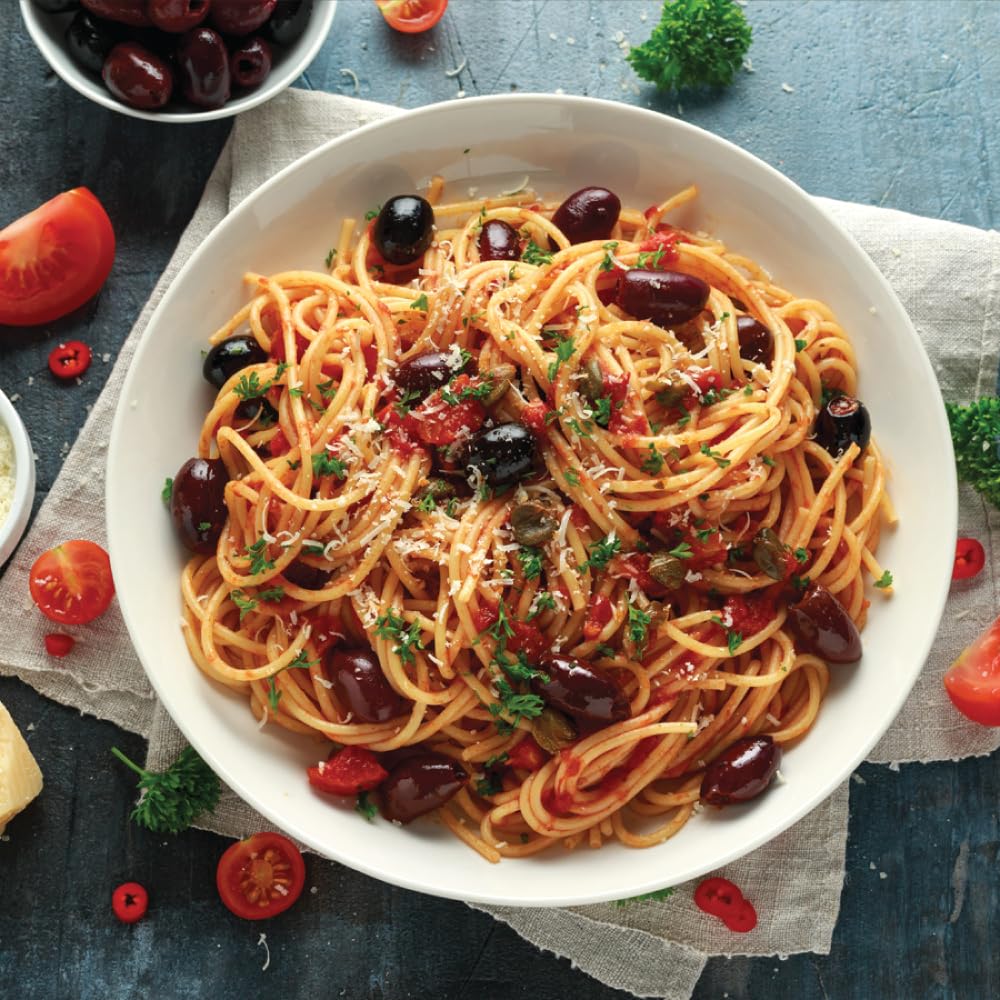 Iliada Kalamata olives in Greek recipe bowl, authentic taste.