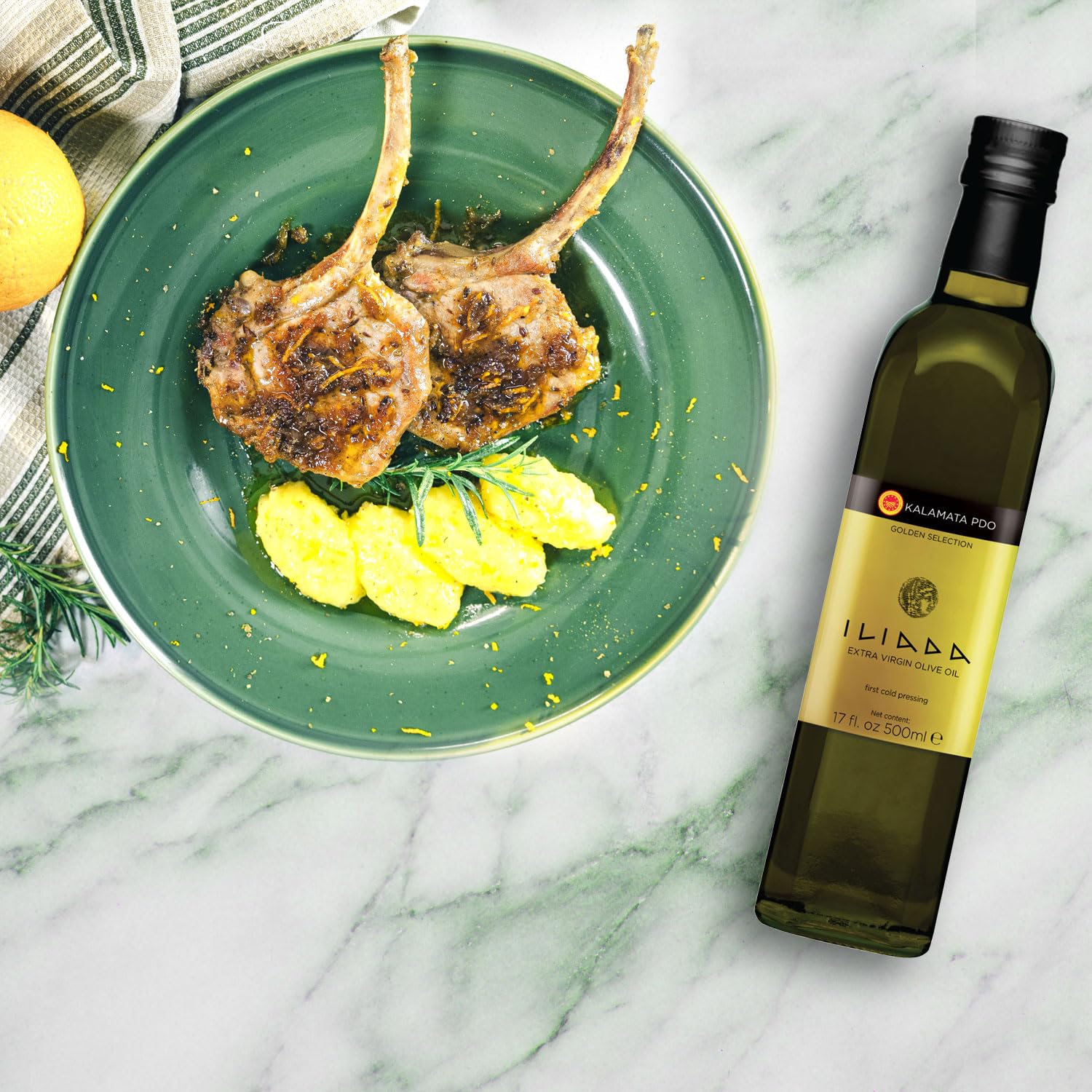 Iliada oil drizzle over vegetables ready for finishing touch.