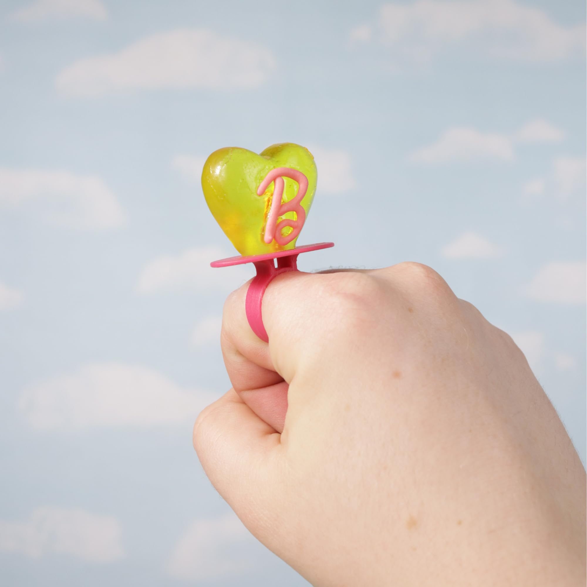 Imaginings 3 colorful party sweets enhance Barbie themed event aesthetics.