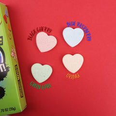 Imaginings 3 Warheads blue raspberry hearts provide electric tang for celebrations.