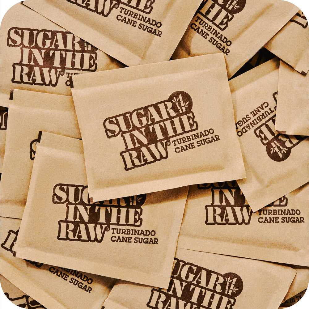 IN THE RAW Turbinado Packets in baking setup showcase versatile pantry sweetener.