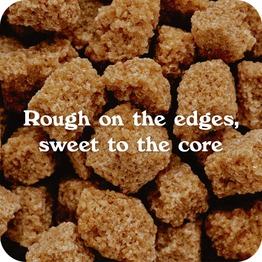 Close-up of IN THE RAW turbinado sugar cubes in tea for depth