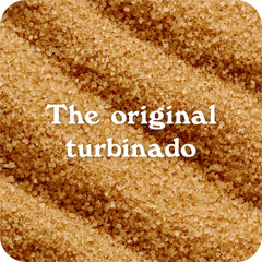 IN THE RAW Turbinado sugar golden crystals close-up showcase rich molasses color.