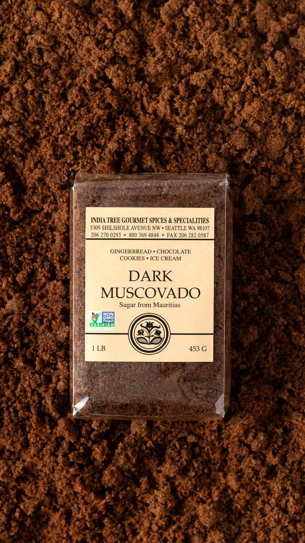 India Tree Dark Muscovado Sugar texture closeup reveals fine, moist crystals ideal for desserts.