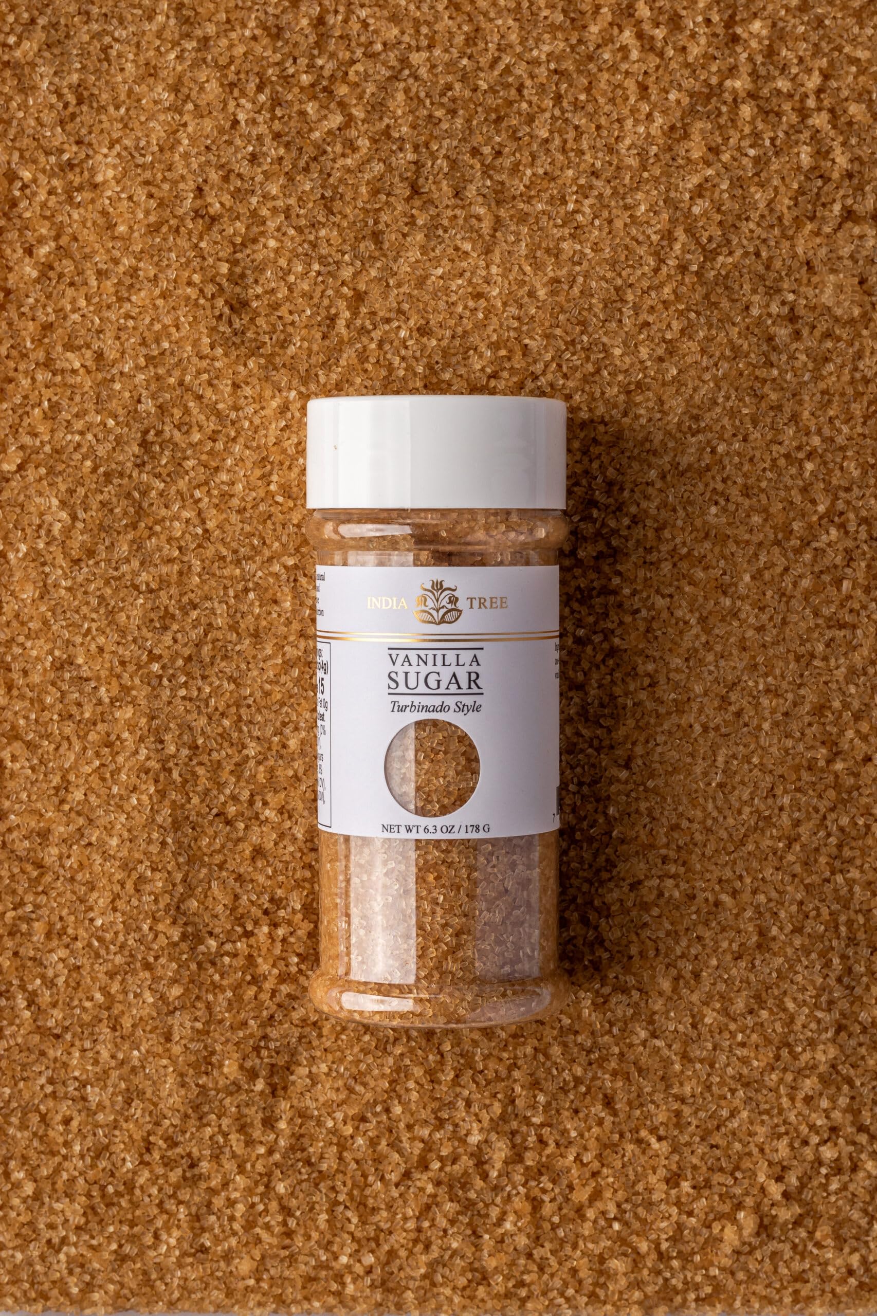 Close-up of India Tree Vanilla Sugar jar highlighting organic origin label.