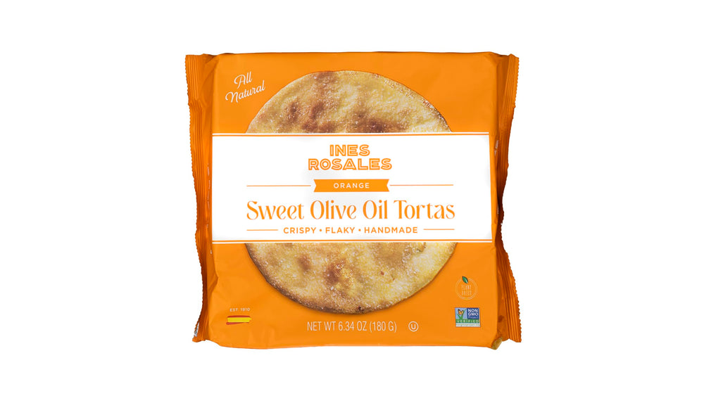 Sliced Ines Rosales Sweet Seville Orange Torta served on a plate, great with cheese.