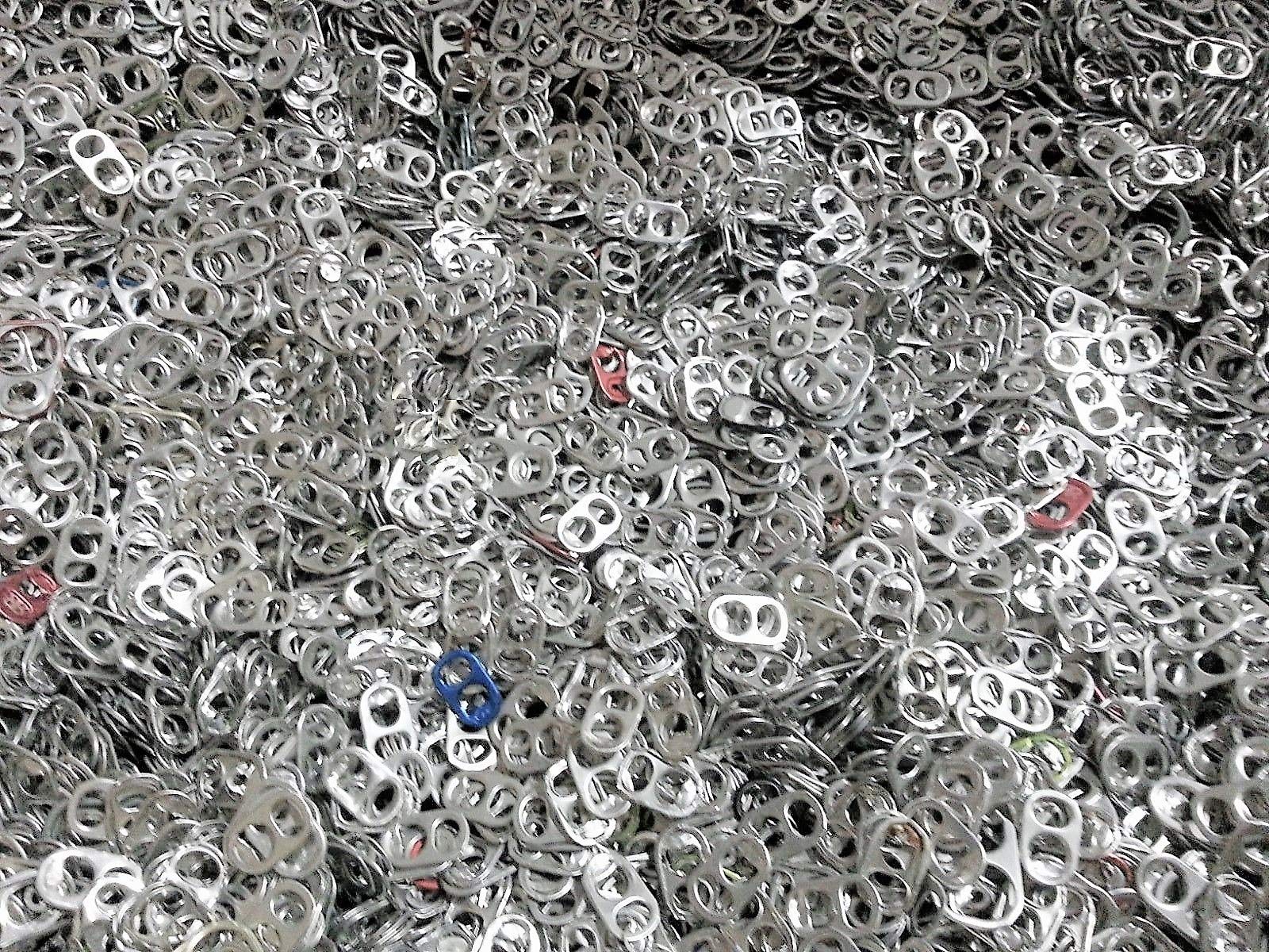 Intotal aluminum pop tabs close-up, ideal for crafts or fundraising projects.