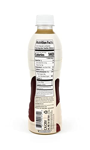 Ito En Black Milk Tea bottle on a desk for convenient on the go enjoyment.