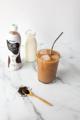 Ito En Black Milk Tea glass with ice emphasizes refreshing serve.