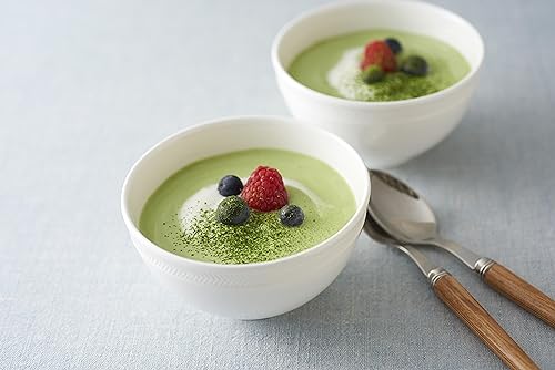 Cup of creamy matcha latte prepared with Ito En sticks at home.