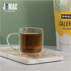 J Mac Botanicals calendula cocktail garnish adds color to drinks.