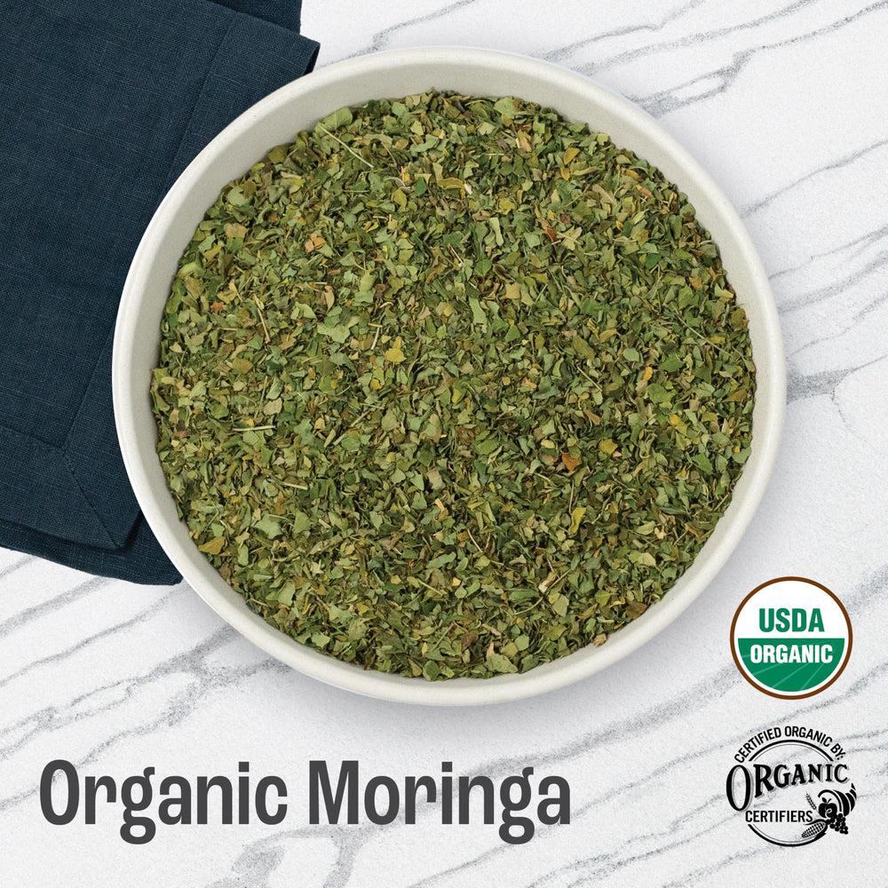 J Mac Botanicals moringa tea cup showing vibrant aroma and flavor