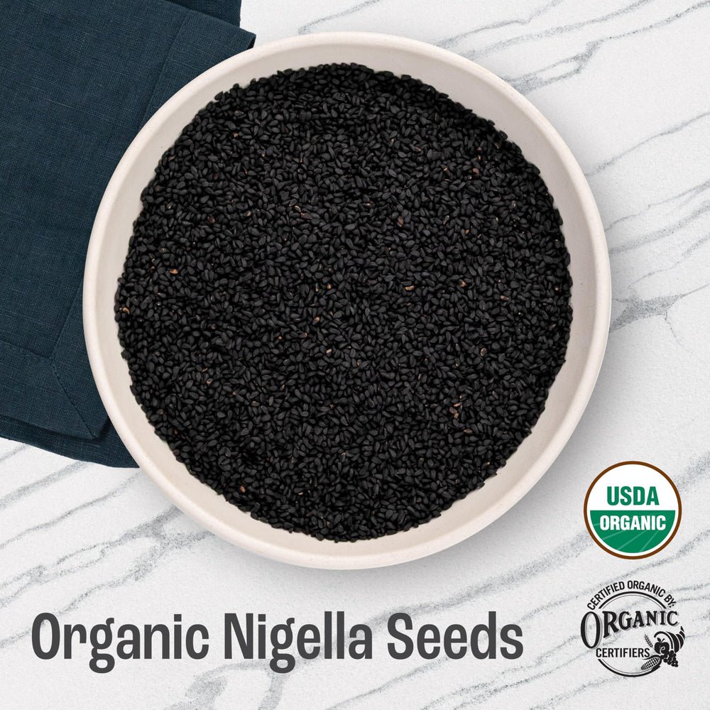 Close-up of black cumin seeds from J Mac Botanicals for breads.