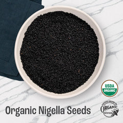 Close-up of black cumin seeds from J Mac Botanicals for breads.