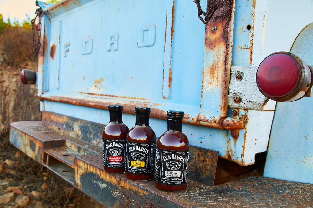 Table-ready bottle of Jack Daniels Barbeque Sauce Sweet and Spicy on display for gatherings.