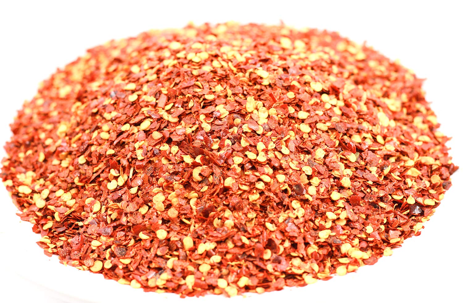 Jack Hua JHC Thai chili flakes in a bowl to elevate soups and noodles.
