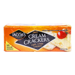Jacob's Cream Crackers on a plate with cheese, a crisp pairing for cheese lovers