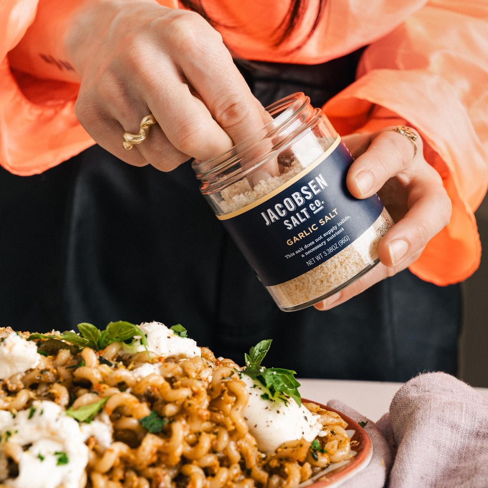 Jacobsen Garlic Salt kitchen scene highlighting essential seasoning in action.