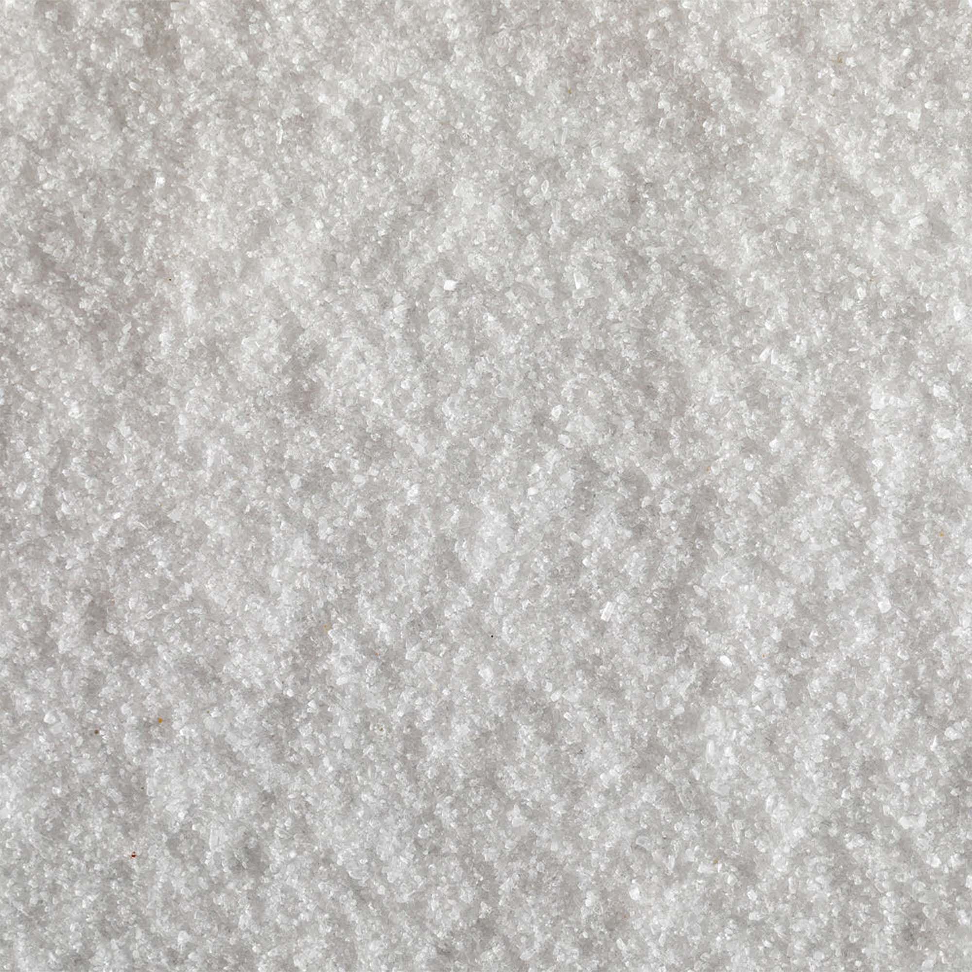 Jacobsen Salt Co. Fine-grain sea salt on kitchen counter ready for cooking or baking.